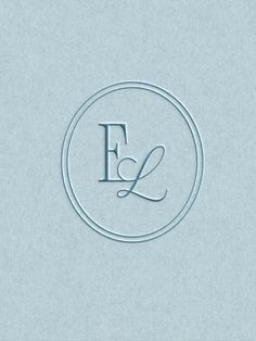 the letter e is inscribed in a circle with a monogramic font on it