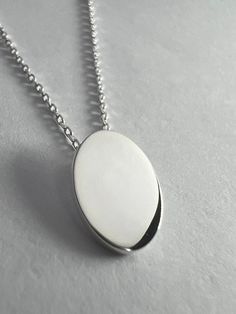 "Minimal \"Oval\" Sterling Silver Necklace By SterlingVerse 🤍Solid Sterling Silver Pendant + 18 inch x 2mm chain 🤍 Minimal in style, floating by design 🤍 Lifetime Warranty 🤍 Free Shipping ✈️" Cheap Oval Sterling Silver Necklaces, Modern Silver Necklace With Oval Pendant, Oval Cable Chain Jewelry Gift, Oval Cable Chain Jewelry As Gift, Modern Oval Necklace With Polished Finish, Gift Jewelry With Oval Cable Chain, Modern Oval White Gold Necklace, Minimalist Oval Pendant Necklace For Gift, Everyday Oval Necklace With Polished Finish