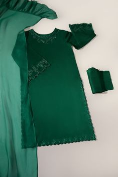 A stunning three piece on pure emerald green raw silk with cutwork embroidery, styled with a matching frilly dupatta and pencil trousers. Turn heads in “ Emerald Cutwork “The length of the kameez is 42 inches. Order Duration: 4 to 6 weeks Eid Dress Ideas, Print Motifs, Pencil Trousers, Function Dresses, Womens Pants Design, Dress Designing, Stitching Ideas, Designing Ideas, Cutwork Embroidery