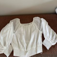 Beautiful Cotton And Silk Blouse By Alice And Olivia. Cropped, But Not Too Short. Filmy And Soft And Lovely. Perfect Condition. Never Worn (But Tags Were Removed While Trying It On). Elegant Peasant Top With Blouson Sleeves, Elegant Peasant Top With Puff Sleeves, Elegant Smocked Bodice Blouse For Brunch, Elegant Blouse With Smocked Bodice For Brunch, Elegant White Top With Smocked Bodice, White Peasant Top With Blouson Sleeves For Summer, Elegant White Peasant Top With Blouson Sleeves, Elegant Summer Peasant Top, Elegant White Long Sleeve Peasant Top