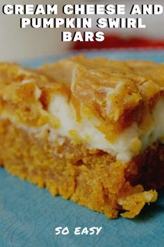 pumpkin cheesecake layered bars on a blue plate with text overlay that says layered bars