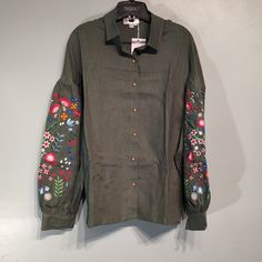 Vyshyta Store Ukrainian Embroidered Linen Shirt Size Large Dark Green In Color Casual Cotton Blouse With Embroidered Cuffs, Fall Cotton Blouse With Embroidered Cuffs, Casual Long Sleeve Shirt With Floral Embroidery, Summer Long Sleeve Blouse With Embroidered Cuffs, Green Long Sleeve Top With Floral Embroidery, Casual Collared Blouse With Floral Embroidery, Cotton Embroidered Cuff Long Sleeve Top, Long Sleeve Cotton Embroidered Top With Cuffs, Cotton Embroidered Long Sleeve Top