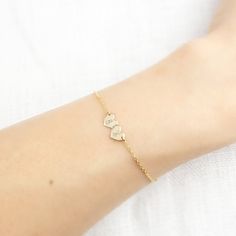 "So dainty and so sweet 14k gold bracelet. This heart double initial bracelet is perfect jewelry to show love and affection. Will make a perfect gift, or buy one for yourself to keep special someone's initial closer to your heart. This subtle and simple style will also make a great addition to your layering bracelet. * Engraving & Font: Choose your font from the font reference photo above and your two initials to \"note\" during checkout. Script font is by default if not chosen. Engraving wi Dainty 14k Gold Bracelet For Personalized Gift, 14k Gold Name Bracelet With Initials For Anniversary, 14k Gold Initials Name Bracelet For Anniversary, Personalized Dainty Gold Bracelet, Dainty 14k Gold Bracelet As Personalized Gift, Minimalist Yellow Gold Heart Bracelet For Anniversary, Dainty Yellow Gold Name Bracelet With Initials, Dainty 14k White Gold Heart Bracelet, Personalized White Gold Elegant Charm Bracelet