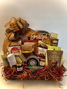 a basket filled with lots of different types of food and snacks on top of a table