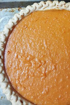 an uncooked pie sitting on top of a pan