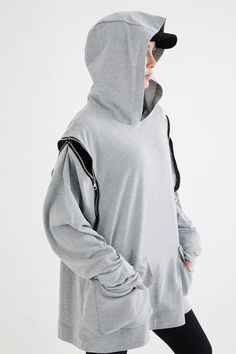 "🚚..ALL ORDERS ARE SHIPPED VIA DHL EXPRESS MAIL The greatest sweater ever! Heather gray cotton-blend jersey zipper detail sweater featuring a hooded, long sleeves with wide ribbed cuffs, two front flap pockets, a relaxed fit and zipper side front and back details. * Pullover style * Hooded * Long sleeves with wide ribbed cuffs * Silver-tone zip details at side front and back * Ribbed hem * Two front flap pockets * Oversized silhouette Measurements approximately: Shoulder: 32\" (81.5 cm) Armhole Urban Half-zip Hoodie For Fall, Urban Half-zip Fall Hoodie, Streetwear Long Sleeve Sweatshirt With Zipper, Long Sleeve Sweatshirt With Zipper For Streetwear, Gray Techwear Sweatshirt For Fall, Oversized Half-zip Sporty Sweater, Sporty Oversized Half-zip Sweater, Winter Half-zip Sweatshirt With Double-lined Hood, Winter Half-zip Hoodie For Streetwear