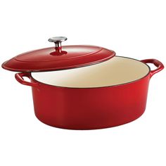 a red casserole with a lid and handle on the bottom, sitting in front of a white background