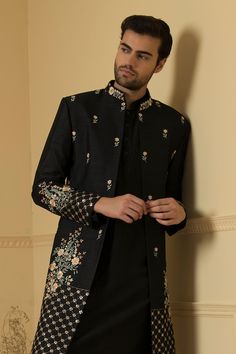 Black jacket embroidered with floral patterns embellished with cutdana and sequin. Comes with plain kurta and pant.
Components: 3
Pattern: Embroidered
Type Of Work: Cutdana,Squin
Neckline: Jacket and Kurta: Mandarin Collar
Sleeve Type: Jacket: Full
Fabric: Semi Raw Silk
Color: Black
Other Details: 
Side slits
Closure: Kurta: Button
Occasion: Sangeet,Cocktail and Reception - Aza Fashions Traditional Fitted Outerwear With Embroidered Sleeves, Fall Wedding Sets With Floral Embroidery, Fall Wedding Floral Embroidered Sets, Fall Wedding Floral Embroidery Sets, Embroidered Designer Wear Sets For Fall, Fitted Stand Collar Outerwear With Intricate Embroidery, Embroidered Fall Designer Wear Sets, Transitional Fitted Outerwear With Floral Embroidery, Embroidered Fall Designer Sets