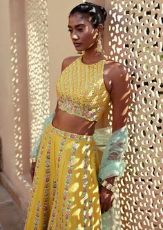 Yellow dupion silk resham and mirror work embroidered pants and incut shoulder top paired with contrast tulle dupatta. Tissue Silk Palazzo Set For Party And Festivals, Festive Cotton Silk Palazzo Set For Party, Navratri Party Palazzo Set In Tissue Silk, Party Tissue Silk Palazzo Set For Navratri, Festival Party Tissue Silk Palazzo Set, Navratri Party Tissue Silk Palazzo Set, Summer Georgette Sets With Sheer Dupatta, Summer Sets With Sheer Dupatta In Georgette, Summer Festive Organza Palazzo Set