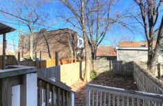 the back yard is fenced off with wood