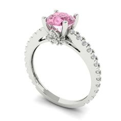 a pink diamond ring with white diamonds on it