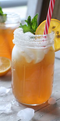 two mason jars filled with lemonade and ice