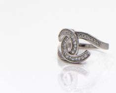 Elegant sparkling engagement ring made of silver and coated with Rhodium. A symbolic knot of love and commitment in an attractive wrap of a beautiful ring that says it all. Size : 52 See more rings in my shop: https://www.etsy.com/shop/batyas?section_id=12526269&ref=shopsection_leftnav_4 Back to my shop: https://www.etsy.com/shop/batyas?ref=si_shop Thank you for stopping by and have a great day :) JEWELRY CARE - Some important notes All jewelry needs special care - whether it is solid gold o Elegant Adjustable White Gold Diamond Ring, Modern Twist White Gold Diamond Ring As Gift, Silver Promise Ring With Elegant Design, Modern Twist Silver Rings With Round Cut, Modern Twist Rings With Diamond Accents As Gift, Silver Rings With Modern Twist And Round Cut, Modern Twist Rings With Diamond Accents For Gift, Modern Twist Sterling Silver Diamond Ring As Gift, Silver Diamond Ring With A Modern Twist