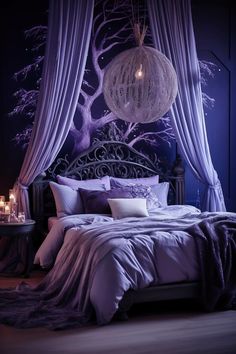 a bed with purple sheets and pillows in front of a canopy over it, surrounded by candles