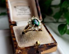 A TRULY EYE CATCHING VINTAGE RING A Gorgeous Combination of Stones All Set in a Superb Solid 9ct Gold Setting The Ring comes with a set of Full British Hallmarks for authenticity. Stones are 8x6mm and 3mm Size UK M Size USA 6 RESIZING IS AVAILABLE Vintage Emerald Ring With Halo Setting For May Birthstone, Vintage Green Cluster Ring With Halo Setting, Vintage Emerald Cluster Ring As Gift, Vintage Emerald Cluster Ring As A Gift, Vintage Emerald Cluster Ring With Prong Setting, Vintage Oval Emerald Cluster Ring, Vintage Emerald Ring For May Birthstone Wedding, Vintage Emerald Ring For Wedding And May Birthstone, Vintage Emerald Wedding Ring For May Birthstone