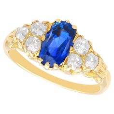 A fine and impressive antique 2.30 carat Ceylon sapphire and 1.05 carat diamond, 18 karat yellow gold ring; part of our Edwardian sapphire jewellery collections. This fine and impressive Edwardian sapphire and diamond ring has been crafted in 18k yellow gold. The scroll decorated setting is ornamented with a central claw-set feature 2.30ct cushion cut Ceylon sapphire. The sapphire is flanked on either side by three Old European round cut diamonds, claw set in a tiered formation, totalling 1.05ct Sapphire Jewellery, Plain Rings, Edwardian Jewelry, Sapphire And Diamond Ring, Ceylon Sapphire, 18k Yellow Gold Ring, Sapphire Jewelry, Vintage Engagement, Yellow Gold Ring