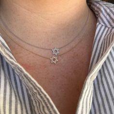 Such a beautiful way to wear your faith proudly with our Star of David pendant! This Judaica is gorgeous stacked or worn on its own! Silver Star Of David Fine Necklace, 14k White Gold Star Necklace, Star Of David Necklace With Diamond Accents As Gift, Sterling Silver Star Of David Fine Jewelry Necklace, Star Of David Necklace With Diamond Accents For Gift, Yellow Gold Star Of David Jewelry With Diamond Accents, Star Of David Necklaces With Diamond Accents For Gift, Silver 14k Gold Necklace With Star Charm, Sterling Silver Star Necklace With Diamond Accents