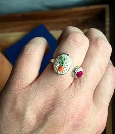 These adorable and very unique rings are truly one of a kind!! These rings are nickel free with a silver finish. The very tiny plant and flower are both hand embroidered. The face of the rings are about the size of a dime as you can see from the pictures. The flower is around the size of a popcorn seed. That should give you better perspective of how small the embroidery detail is! They are also both adjustable. They can be made bigger or smaller by opening or closing the ring.  I created these f Cute Adjustable Hand-painted Jewelry, Cute Adjustable Hand Painted Jewelry, Handmade Cute Sterling Silver Rings, Cute Handmade Sterling Silver Rings, Cute Handmade Flower Ring For Gift, Handmade Cute Sterling Silver Jewelry, Cute Handmade Sterling Silver Jewelry, Handmade Oval Flower Ring As A Gift, Handmade Cute Promise Ring