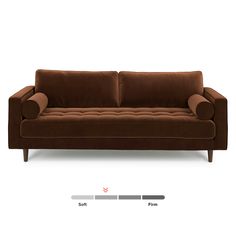 a brown couch sitting on top of a white floor