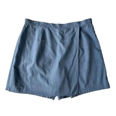 A cute blue linen / rayon blend mini skort from the 1990s / early 2000s! It has a high waist with a side button closure and an above the knee length.  Brand: C.J. Banks Material: 55% Linen 45% Rayon Size: tagged size 18W  (but please review measurements)  Measurements:  Waist: 39" Hip: 54" Length: 20.5" Rise: 15" Inseam: 8" Condition: Great vintage condition! Clean and ready to wear! Follow us on Instagram @missdorothyvintage for previews and first dibs or @shopmissdorothy for deals on damaged beauties!  Please read our shop policies and FAQs prior to purchase. Returns for refunds are not accepted, so make sure to ask any questions prior to making a purchase Summer Cotton Skort (shorts Skirt), High Waist Solid Cotton Skort, Blue Skort With Short Inseam For Summer, Summer Cotton Skort With Relaxed Fit, Summer Cotton Relaxed Skort, Summer Cotton Skort, Blue Short Inseam Mini Skirt For Spring, Spring Blue Mini Skirt With Short Inseam, Blue Mini Skirt With Short Inseam For Spring