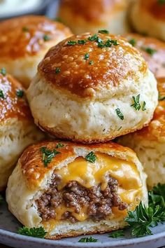 some biscuits with cheese and meat are on a plate