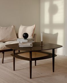 a coffee table with two books on it