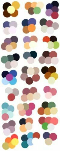 an array of different colored circles on a white background