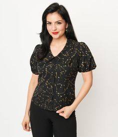 This sweet 1930s style separate is crafted in a black woven crepe that features shimmering golden stars and constellations throughout. The front button placket leads to the oversize collar framed by a puff sleeve silhouette complete with elastic cuffs. Available in sizes XS-5X while supplies last Oversize Collar, Stars And Constellations, 1930s Style, Sleeve Silhouette, Oversized Collar, 1930s Fashion, Golden Star, Collar Blouse, Gold Stars