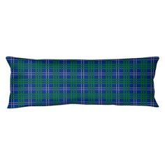 a blue and green plaid pillow on a white background