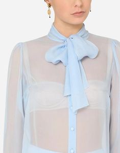 The Sheer Silk Chiffon Shirt from Dolce & Gabbana is perfect summer statement piece. Made weightless chiffon, it boasts a delicate aniseed light blue color and feminine pussy bow collar. Elevate your formal looks with this elegant airy shirt. Shifon Blouse, Light Logo, Light Blue Blouse, Blouse Sale, Bow Collar, Leg Work, Elegant Blouses, Chiffon Shirt, Alternative Outfits