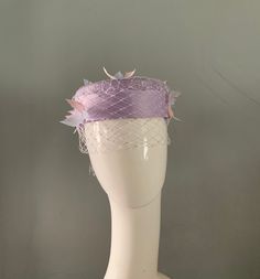 Here i have handed a Lilac pillbox hat adorned with Merry Widow veiling silk satin band and bow finished with pale blue & pink feather details. Attaches to the head with millinery elastic,comfortable on the head & easily hidden in the hair. colour samples are available message me for details. Like this style in another colour ?...contact me for details of my made to order service. Each item is hand crafted from start to finish entirely by myself using traditional millinery techniques & a little Colour Samples, Merry Widow, Pillbox Hat, Pink Feathers, Pill Boxes, Colored Contacts, Hair Colour, Pale Blue, Silk Satin