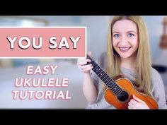 a woman holding an ukulele with the words you say easy ukulele