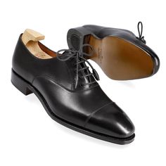 WOMEN'S OXFORDS IN BLACK VITELLO Classic Cap Toe Lace-up Shoes For Galas, Classic Cap Toe Oxfords For Galas, Classic Oxfords With Rubber Sole For Galas, Timeless Black Oxfords With Round Toe, Classic Black Lace-up Oxfords, Cap Toe Oxfords With Rubber Heel Cap For Galas, Timeless Black Almond Toe Oxfords, Classic Oxford Shoes With Leather Sole, Classic Black Cap Toe Lace-up Shoes