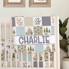 a baby crib bedding set with the name charlie on it