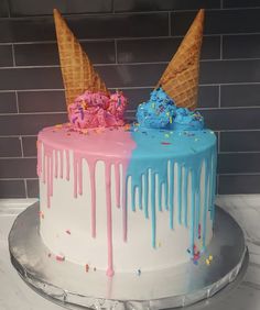 two cakes with ice cream and sprinkles on them