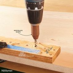 a drill is being used to make holes in wood