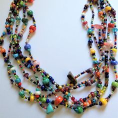 Artisan Czech Glass Bead 6 Strand 18" Long Fashion Statement Necklace Multi-Color Brights A Total Length Of 18" Long, With Glass Beads & Semi Precious Stone Chips. Easy To Open/Close Magnetic Clasp. One Of A Kind Necklace Handcrafted/No Two Are Exactly Alike Czech Glass Beads Are Know World Wide For Their Quality, Vibrant Colors Handmade In Guatemala Using Artisan Crafted Czech Glass Beads. Principles Of Fair Trade Are Upheld. Red Flower Necklace, Bright Necklace, Enchanted Jewelry, Silver Necklace Simple, Unicorn Necklace, Layered Necklaces Silver, Stone Chips, Hippie Necklace, Mother Of Pearl Necklace