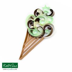 a bouquet of green and brown flowers on top of a wooden stick with white background