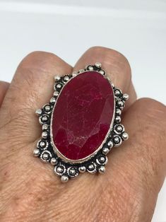 Unusual deep toned raw Ruby low content silver setting handmade size 7.5 Can be resized. My jeweler charges a $10- $20 fee All rings are shipped in a nice gift box. Check out our over a THOUSAND great reviews Engraving is $4 per letter and is not always perfect depending on the piece. It can take a few days if the jeweler is busy. This is payable to Paypal Judithsltd@gmail.com Handmade Oval Ruby Ring Gift, Artisan Ring With Large Stone For Gift, Antique Untreated Jewelry Gift, Unique Handmade Oval Ruby Ring, Unique Silver Ruby Ring With Stone Setting, Unique Handmade Ruby Ring Gift, Unique Handmade Ruby Ring As Gift, Handmade Spiritual Ruby Ring As Gift, Oval Ruby Ring With Large Stone For Gift