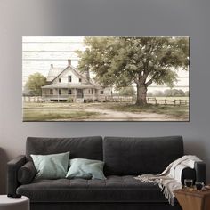 a living room with a couch and painting on the wall