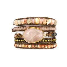 Introducing the Rose Quartz Boho Gemstone Layered Wrap Bracelet, an enchanting piece that combines bohemian charm with refined elegance. Handcrafted with meticulous care, each bracelet is a unique expression of style and grace, making it the perfect accessory for any occasion. This bracelet features five exquisite layers of natural rose quartz stones, resin, glass, and metal beads. The soft pink hues of rose quartz, known as the stone of love and harmony, are beautifully complemented by the dive Bohemian Pink Jewelry With Gemstone Beads, Bohemian Adjustable Rose Quartz Jewelry, Adjustable Bohemian Rose Quartz Jewelry, Bohemian Rose Quartz Healing Jewelry, Adjustable Bohemian Crystal Bracelet With Stones, Bohemian Rose Quartz Beaded Bracelets For Healing, Bohemian Rose Quartz Beaded Bracelets As Gift, Rose Quartz Beaded Jewelry With Stones, Bohemian Rose Quartz Gemstone Beads Jewelry