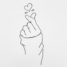 a black and white drawing of a hand holding a heart