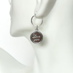 ▪︎ ONE sterling silver round charm with LOVE YOU inscribed on it. ▪︎ Size: 13 x 15 mm ( 17mm with hoop) Weight: 1.3 gm ▪︎ This is a multi functional charm and can be used with neck chains, ear hoops, bracelets, anklets, key chains etc. ▪︎ This pendant is handmade with hypoallergenic sterling silver, and is nickel free. Comes with a 925 mark for authenticity. ▪︎ Please note: Price listed is for ONE charm. This pendant comes WITHOUT the chain, however, you can add a snake neck chain, bracelet chai Inspirational Charms Jewelry As A Gift, Inspirational Charms Jewelry Gift, Sterling Silver Charms Round Pendant For Gifts, Sterling Silver Round Pendant Charms For Gifts, Sterling Silver Round Charms For Mother's Day, Silver Round Pendant Charms For Anniversary, Metal Charms For Gifts, Meaningful Charms Jewelry As Gift, Nickel Free Pendant Charms For Gifts