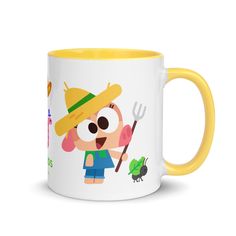 a yellow and white coffee mug with an image of a cartoon character holding a fork