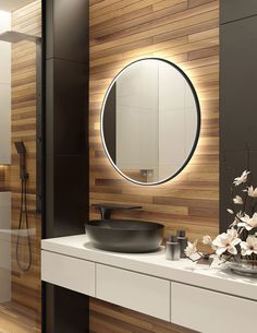 a bathroom with a sink, mirror and bathtub in the background is wood paneled walls