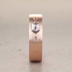 a rose gold wedding ring with an octagonal cut diamond