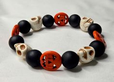 This bracelet is adjustable and stretchy for maximum comfort. Adjustable Casual Wristband Bracelet, Casual Adjustable Wristband, Adjustable Novelty Wristband, Casual Hypoallergenic Jewelry, Casual Black Bracelets For Halloween, Adjustable Multicolor Novelty Stretch Bracelet, Adjustable Black Stretch Bracelet For Beach, Casual Black Stretch Bracelet As A Gift, Casual Stretch Bracelet With Round Beads