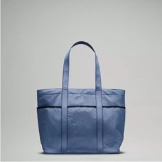 Blue Oasis Color! Nwt. Water Repellant Material. This Color Is No Longer Made. Dimensions: 51cm X 15cm X 35cm (20.1" X 5.9" X 13.8") Volume: 20l Blue Shoulder Bag With Pockets For Outdoor Activities, Sporty Blue Shoulder Bag With Pockets, Practical Blue Bag For Outdoor, Practical Blue Outdoor Bag, Blue Tote Bag For Outdoor Use, Blue Tote Bag For Outdoor, Light Blue Nylon Bag For Daily Use, Practical Blue Nylon Bag, Versatile Blue Bags For Outdoor Use