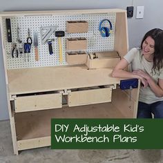 a woman sitting in front of a workbench