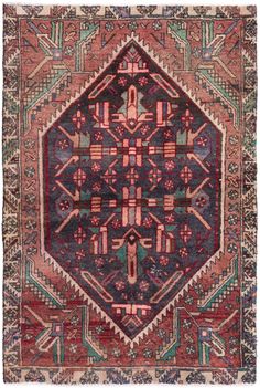 an antique rug with geometric designs and colors on the carpet, it is very colorful